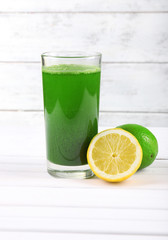 Lime juice and halves of lime and lemon
