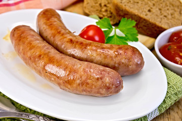 Sausages pork fried in plate on board