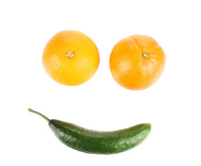 Crazy face from oranges and cucumber.