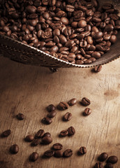 Coffee in bowl on grunge wooden background