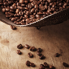 Coffee in bowl on grunge wooden background