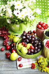 Still life with berries and flowers