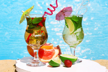 Delicious cocktails on beach, close-up