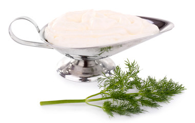 Metal cream bowl with parsley on white background isolated