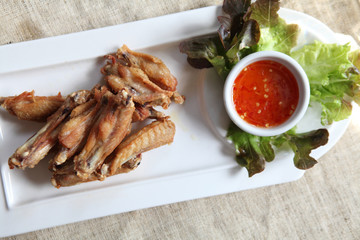 Fried chicken on wood background