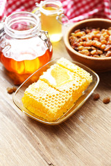 Fresh honey on wooden table