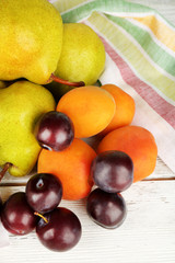 Ripe fruits on table close up