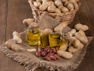 bottles of peanut oil with nuts