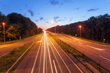 Long exposure photo on a highway at sunset