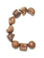 Alphabet letter C arranged from chocolate sweets isolated