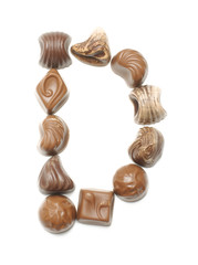Alphabet letter D arranged from chocolate sweets isolated
