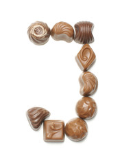 Alphabet letter J arranged from chocolate sweets isolated