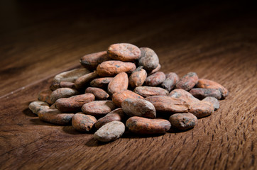 cocoa beans on old wooden desk