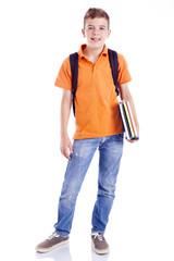 Smiling school boy with backpack holding notebooks, isolated on © cristovao31