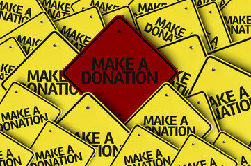 Make a Donation written on multiple road sign