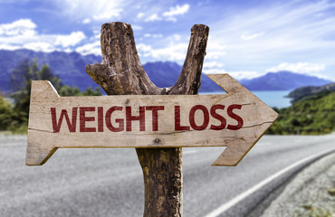 Weight Loss wooden sign with a street background