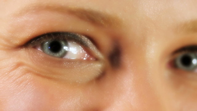 Close up of beautiful blue eyes of woman, studio