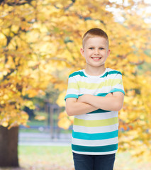 little boy in casual clothes with arms crossed