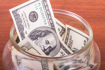 Dollar Banknotes in Glass Bowl