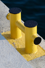 Yellow bollard pier - device for yacht mooring