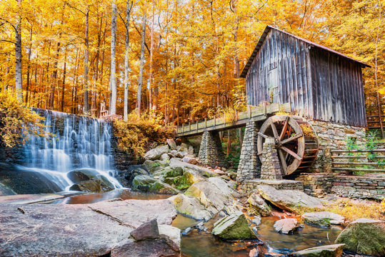 Fall or Autumn image of historic mill and waterfall in Marietta,