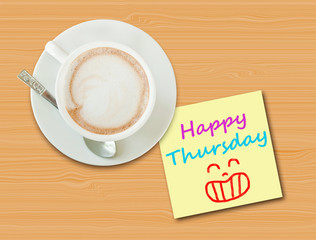 Coffee cup on wood table with paper note 