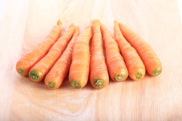 carrot on wooden chopping board