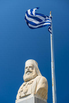 Statue Of Nikos Kazantzakis With Waving Greek Flag