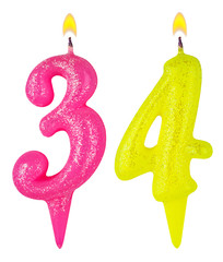 Birthday candles number thirty four isolated on white background