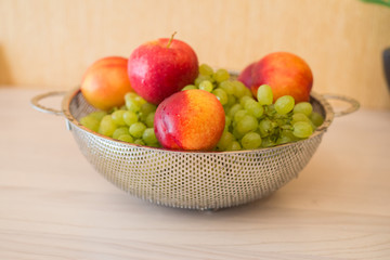 Naklejka na ściany i meble Fruits in the bown on table