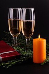 Gift boxes with champagne in romatic atmospfer with candle