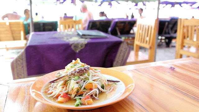 Serve papaya salad Som Tam at the restaurant beach