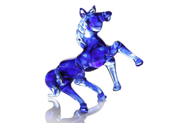 Glass blue horse isolated on white.