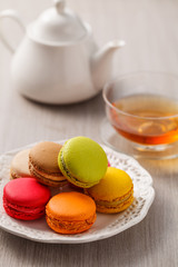 Macaron on dish with tea