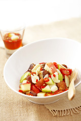 close up mixed fruit salad in dish