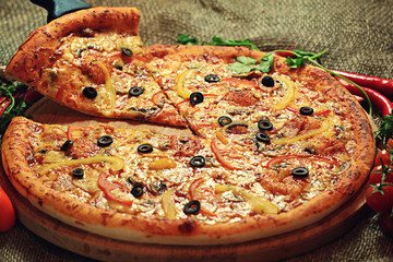 pizza with a slice cut, delicious pastries