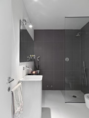 interior view of modern bathroom with glass shower cubicle