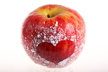 red apple with a heart on a white background