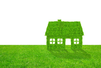 Green house symbol on meadow on white background