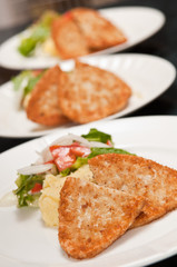 3 plates with breaded chicken