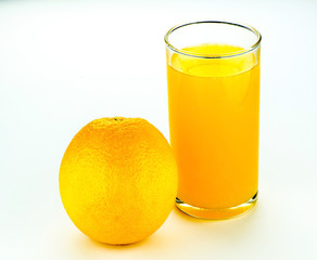 Fresh orange and glass with juice