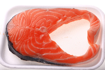 fresh salmon in the box on a white background