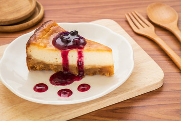 Cheesecake with berries sauce on plate