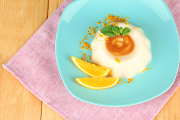 Panna Cotta with orange zest and caramel sauce,