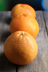 Ripe grapefruits on wooden background