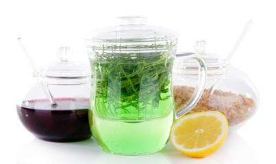 Estragon drink with lemon and brown sugar isolated on white