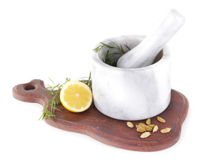Estragon with lemon and cardamom in mortar pounder