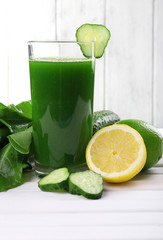 Lime juice, slices of cucumber halves of lime and lemon