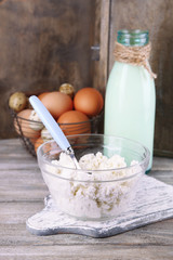 Dairy products and fresh eggs  on wooden background
