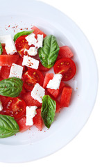 Salad with watermelon, feta and basil leaves